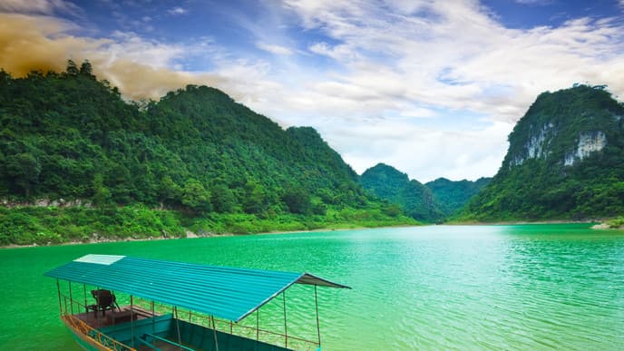 Cruise across an extraordinary emerald lake