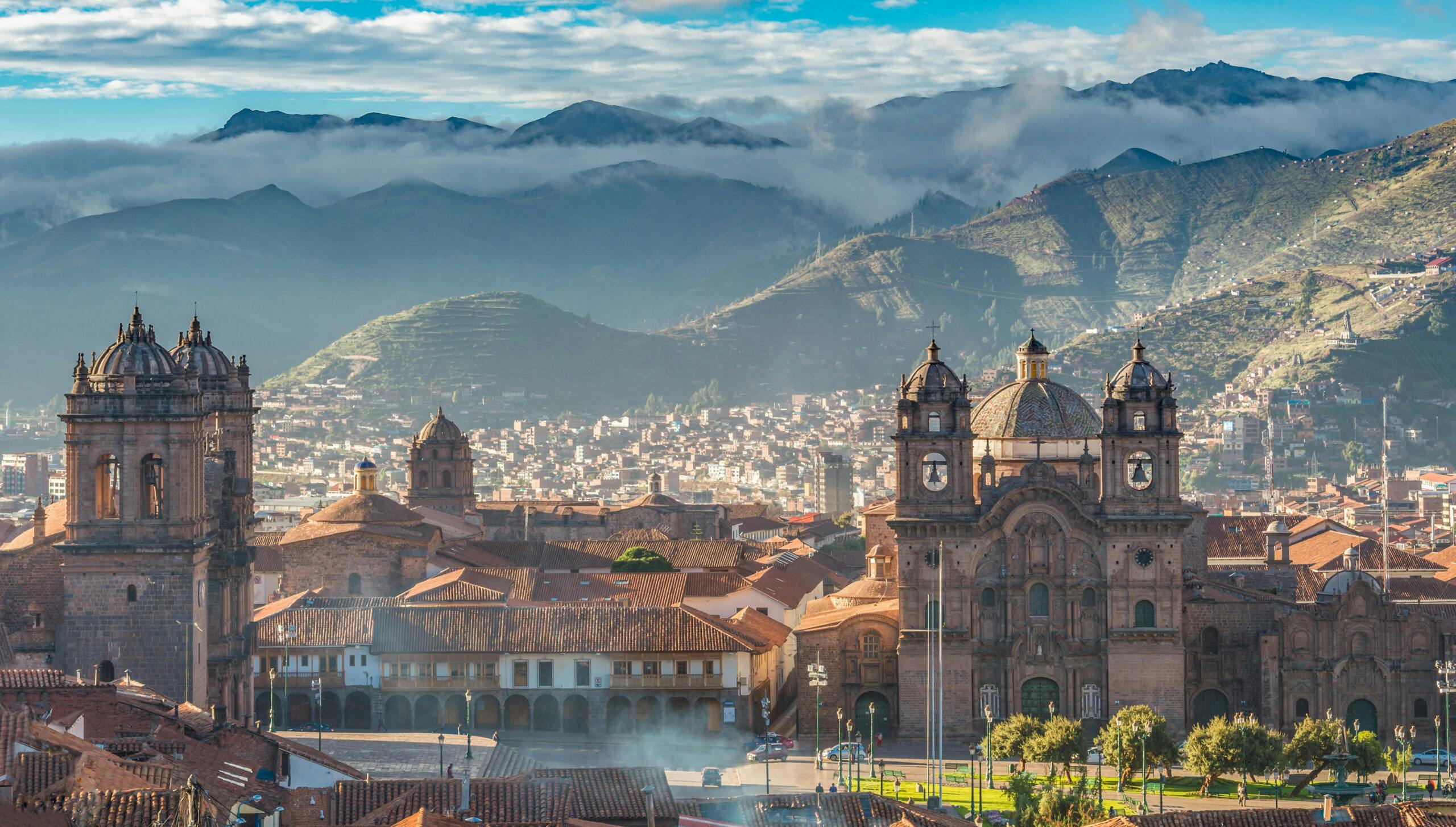 Plaza de armas with Adean Moutain and group of cloud, Cusco, Peru